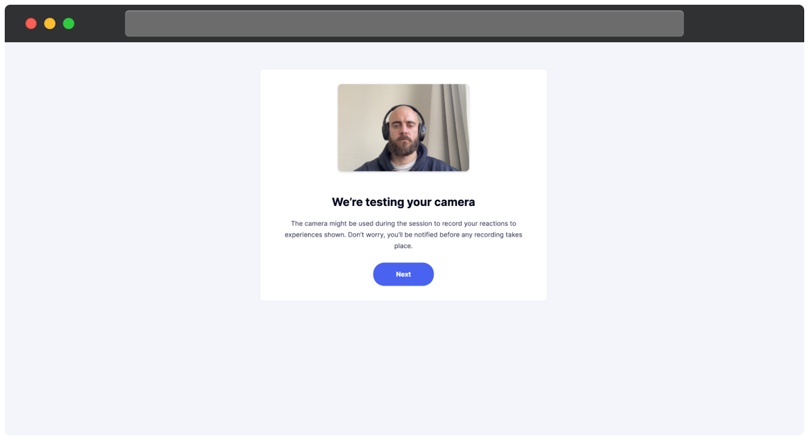 A camera testing screen. The page displays a live camera feed showing the user to ensure the camera is functioning properly. Below the feed, the message informs the user that the camera might be used during the session to record reactions, with an assurance that they will be notified before any recording begins. A blue Next button is displayed at the bottom to proceed.